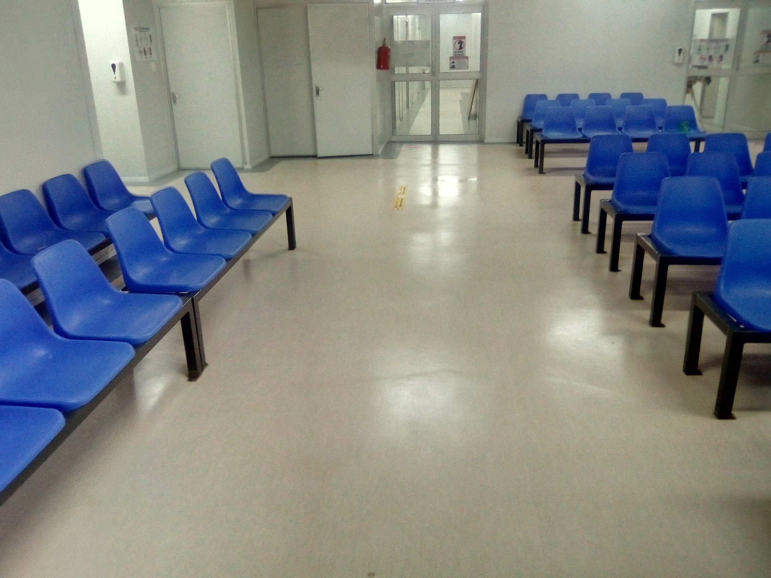 Worn hospital ward flooring before restoration